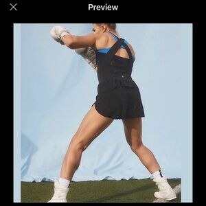 Athleta Black Jumpsuit with Purple Accessories